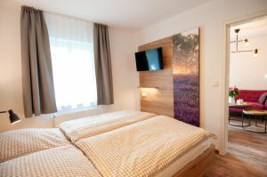 Letto o letti in una camera di Glockenhof Studtmann