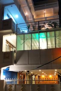 a building with a balcony with lights on it at Hotel Shree Tara in Kathmandu