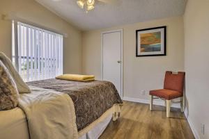 a bedroom with a bed and a chair and a window at Family-Friendly San Marcos Home Close to TSU! in San Marcos