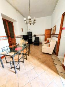 a living room with a table and a couch at CASA BAUTISTA TURIS in Turís