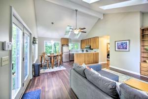 a living room with a couch and a kitchen at Peaceful Nashville Hideaway Near State Parks! in Nashville