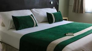 Posteľ alebo postele v izbe v ubytovaní Ecohotel Talca