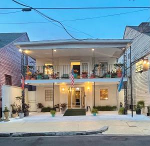 a house on a street at night with flags at Empress Hotel in New Orleans