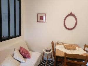 a living room with a couch and a table at le balcon in Camps-sur-lʼAgly +32 photos