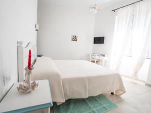 A bed or beds in a room at Affittacamere Solki