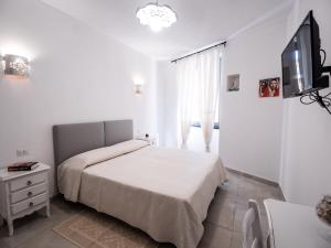 A bed or beds in a room at Affittacamere Solki