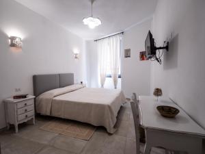 A bed or beds in a room at Affittacamere Solki