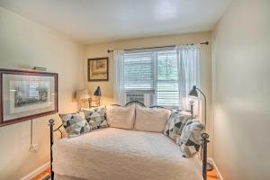 a bedroom with a bed in front of a window at Stockbridge Home Walk to Town Beach! in Stockbridge