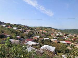 a small town on a hill with houses at Apartment BESO in Kutaisi
