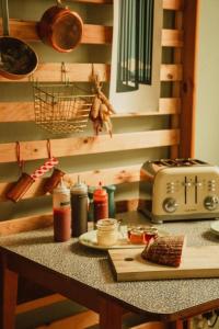 a kitchen counter with a cutting board and a toaster at Ben A'an House in Callander