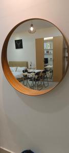 a mirror on the wall of a room with a table at Cyberjaya cybersqure peace home in Cyberjaya