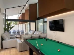 a living room with a pool table at Casa rural - bungalows Spa & Relax in La Felipa