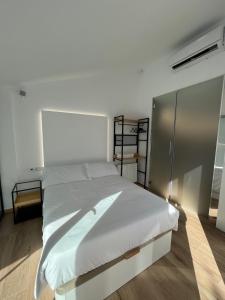 a bedroom with a large white bed in a room at Casa rural - bungalows Spa & Relax in La Felipa +19 photos