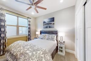 a bedroom with a bed and a ceiling fan at Villa Moreno in Pagosa Springs