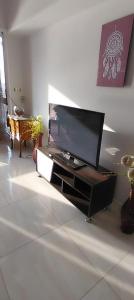 a living room with a flat screen tv on a entertainment center at Omar Apartment in Cairo