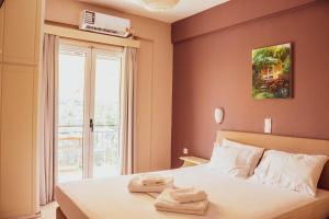 Postel nebo postele na pokoji v ubytování Apagio Apartments