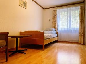 Voodi või voodid majutusasutuse Hotel Gemmi toas
