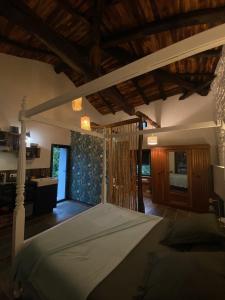 Postel nebo postele na pokoji v ubytování Studio avec terrasse dans mas historique cevenol