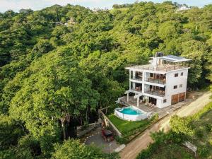 an aerial view of a house with a swimming pool at Casa Paraíso - 2nd Floor in San Juan del Sur