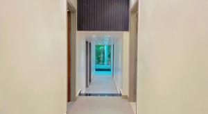 a hallway of a house with white walls at City View With Garden -5 Mins Walk From GOLDEN TEMPLE in Amritsar