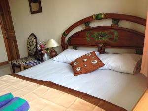 Postel nebo postele na pokoji v ubytování The Reinhold Guesthouse Bali