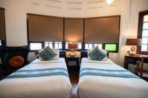 Letto o letti in una camera di Hotel Penaga