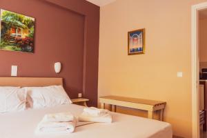 Postel nebo postele na pokoji v ubytování Apagio Apartments