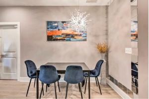 a dining room with a table and chairs at Cozy 4 bedroom Located right downtown ATL in Atlanta
