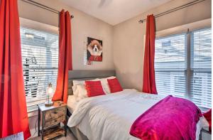 a bedroom with red curtains and a large bed at Cozy 4 bedroom Located right downtown ATL in Atlanta