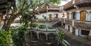 an overhead view of a building with a tree at Hotel los Arcos in Taxco de Alarcón