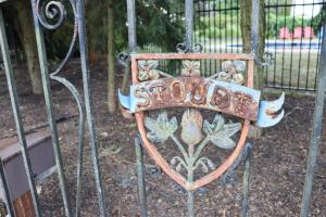 a metal gate with a school sign on it at VAAST Bed & Breakfast in Adamstown