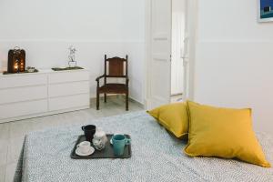 A bed or beds in a room at Casa Grazia Guest House