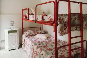 A bed or beds in a room at Casa Grazia Guest House