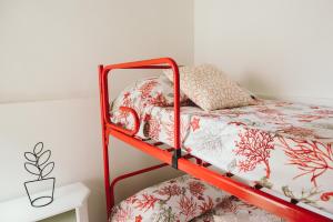 A bed or beds in a room at Casa Grazia Guest House