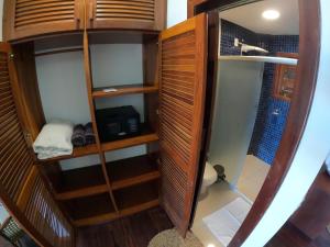 an overhead view of a small room with a toilet at Hotel Vila Marola in Taíba