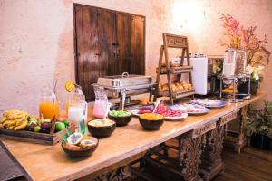 a table with food and drinks on it at Tambo del Arriero Hotel Boutique in Cusco