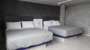 Krevet ili kreveti u jedinici u objektu MOTEL & HOTEL ALJIBE