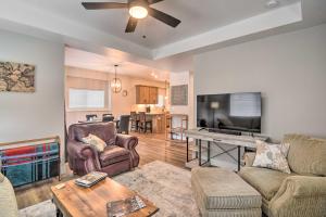 a living room with a couch and a tv at Gorgeous Loveland Townhome Less Than 1 Mi to Downtown in Loveland