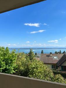 a view of the ocean from the balcony of a house at Alpes Rez in Neuchâtel