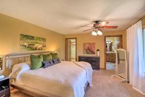 a bedroom with a bed and a ceiling fan at Norfork Lake Getaway Deck, 6 Mi to Main St! in Mountain Home