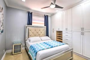 a bedroom with a bed and a ceiling fan at Sleek Hialeah Home about 20 Mi to Downtown Miami! in Hialeah
