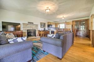 a living room with two couches and a fireplace at McArthur Cabin Peaceful Getaway on Farm! in Stella