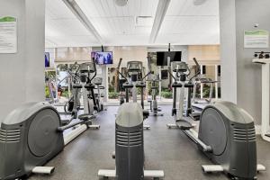 a gym with rows of treadmills and machines at The Tides 1bedroom apt 3rd floor We are on the Beach! in Hollywood