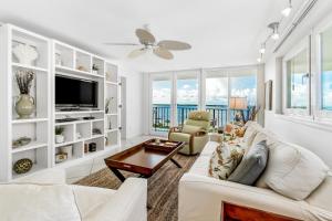 a living room with a couch and a tv at Santa Rosa Dunes 1061 in Pensacola Beach