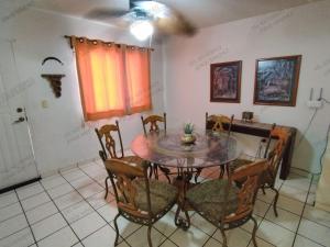 a dining room with a table and chairs at Casa Villa Serena 4 in San Carlos
