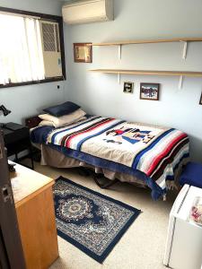 Ένα ή περισσότερα κρεβάτια σε δωμάτιο στο Hill Haven