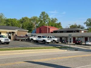 a group of trucks parked in a parking lot at Liberty Motel in Liberty