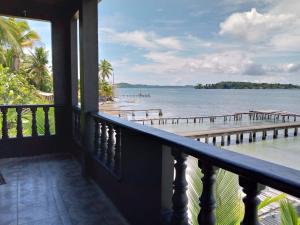 a balcony of a house with a view of the ocean at Mukunda on the sea in Bocas del Toro