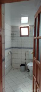 a bathroom with a shower and a toilet at Bungalow with access to a large garden near beach in Kemer