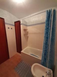 a bathroom with a sink and a bath tub at Casinha da Pena - Tomar (Pedreira) in Tomar